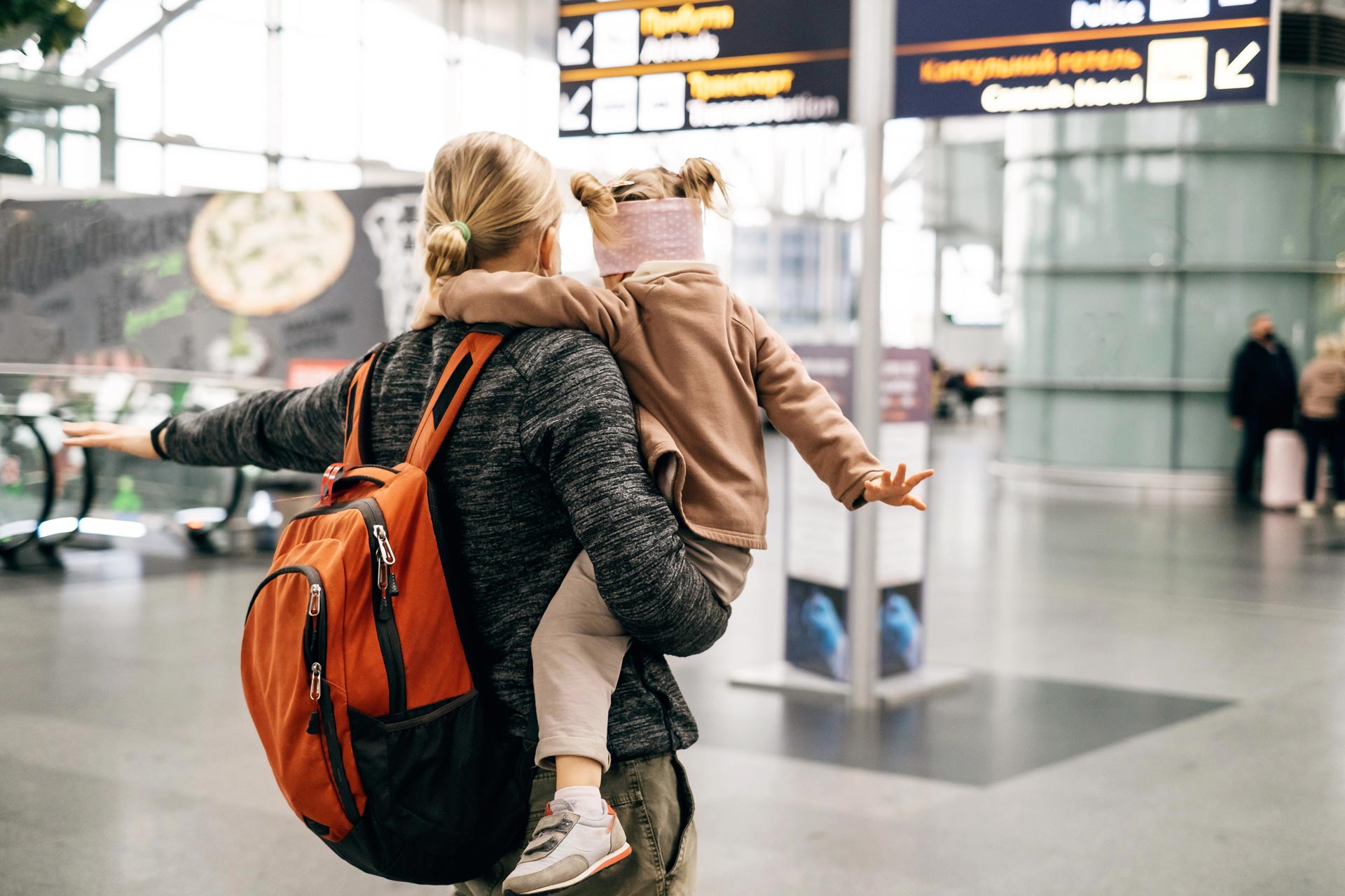 man-and-child-at-the-airport-with-backpack-2025-03-08-05-17-02-utc