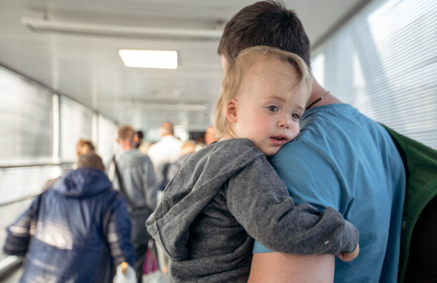 Man with child on travelator