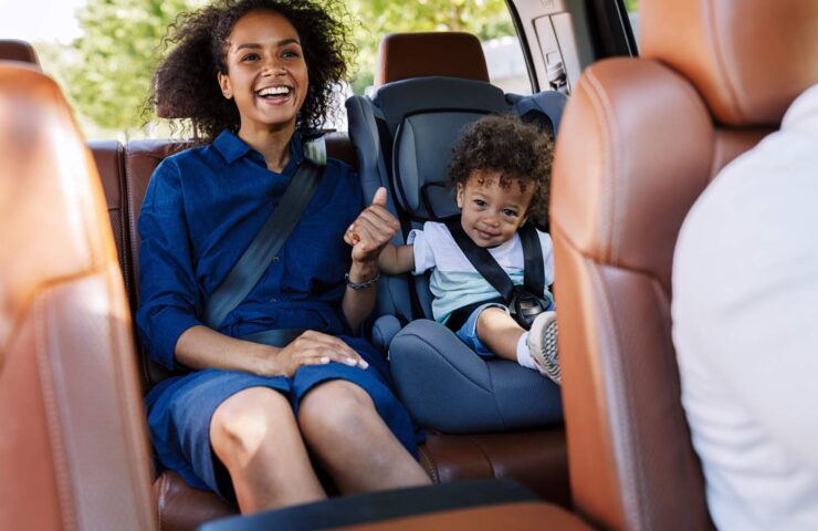 happy-mother-and-her-son-sitting-on-a-backseat-whi-2025-03-10-06-04-48-utc