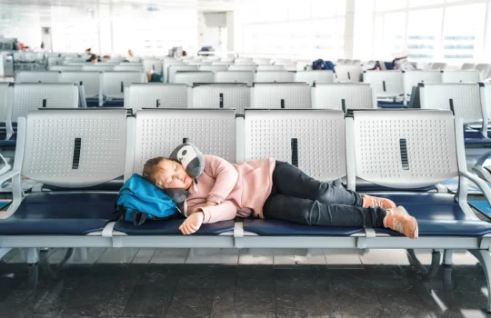 kid-teen-tired-girl-sleeping-waiting-in-airport-2024-12-05-08-54-34-utc.webp