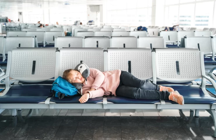 kid-teen-tired-girl-sleeping-waiting-in-airport-2024-12-05-08-54-34-utc.webp