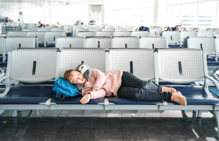 kid-teen-tired-girl-sleeping-waiting-in-airport-2024-12-05-08-54-34-utc.webp