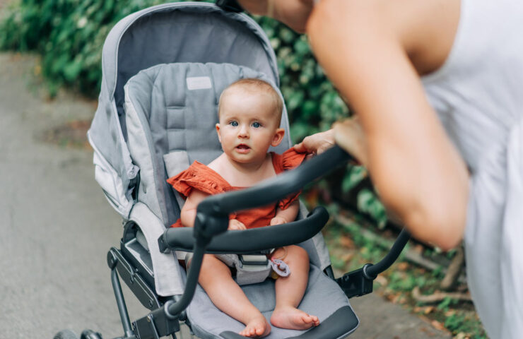 portrait-of-a-baby-sitting-in-a-stroller-with-her-2025-03-09-09-15-01-utc