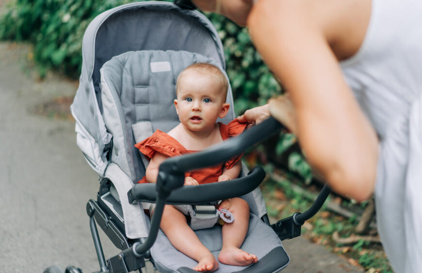portrait-of-a-baby-sitting-in-a-stroller-with-her-2025-03-09-09-15-01-utc