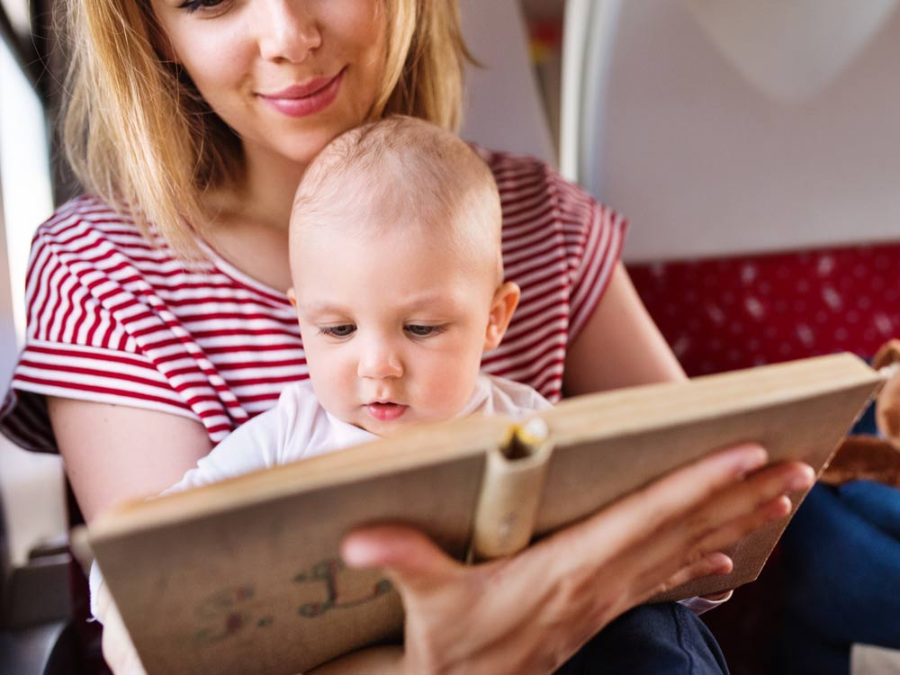 young-mother-travelling-with-baby-by-train-2024-10-20-09-46-14-utc