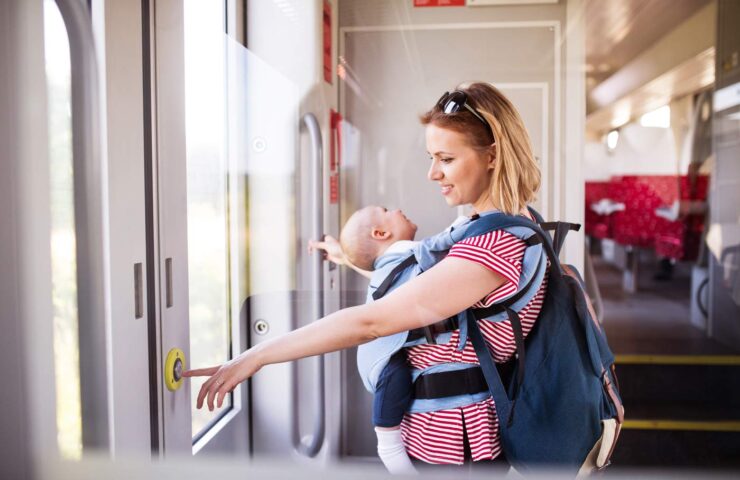 young-mother-travelling-with-baby-by-train-2024-10-20-10-22-23-utc