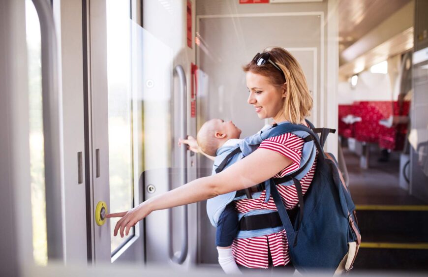young-mother-travelling-with-baby-by-train-2024-10-20-10-22-23-utc