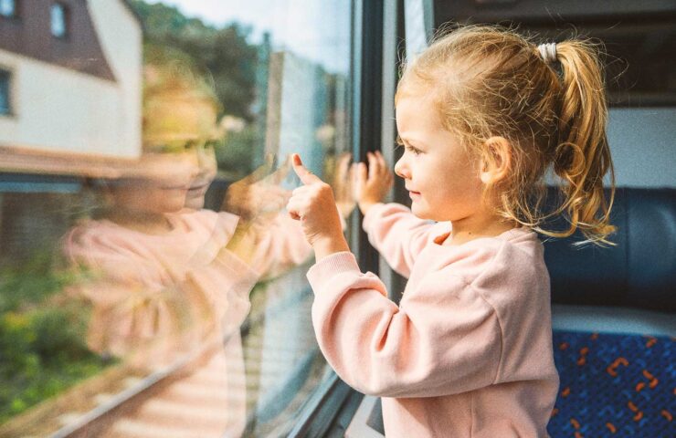 beautiful-little-girl-looking-out-train-window-out-2025-03-10-12-19-57-utc