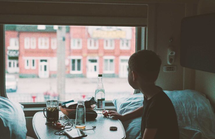boy-in-the-train-compartment-looks-out-the-window-2025-03-10-06-04-55-utc