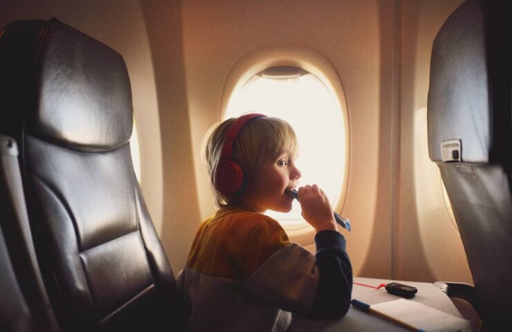 cute-little-boy-traveling-by-an-airplane-2025-02-21-04-35-39-utc