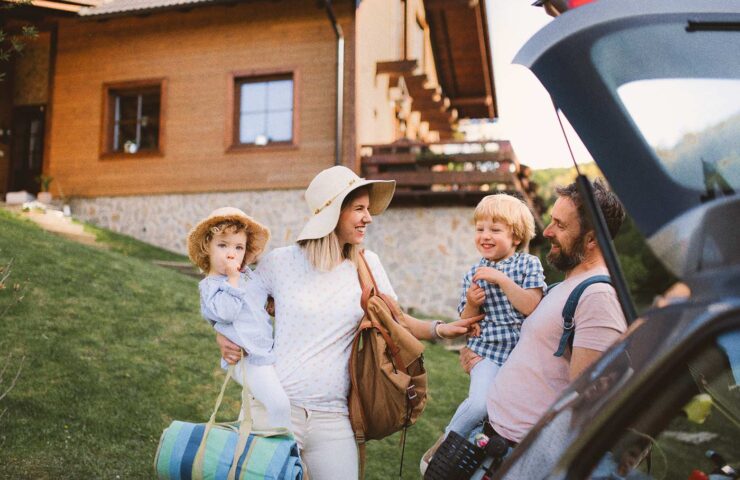 family-with-two-small-children-loading-car-for-tri-2024-10-22-00-42-59-utc