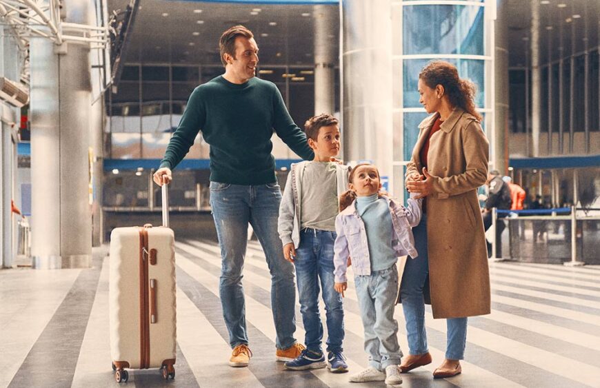 full-length-of-family-with-two-little-kids-waiting-2023-11-27-04-50-49-utc