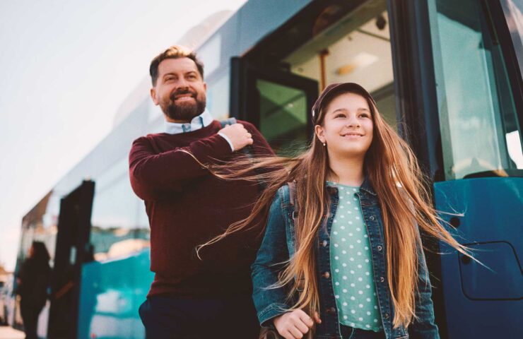 happy-girl-and-her-father-getting-off-the-bus-at-t-2024-12-13-19-21-44-utc
