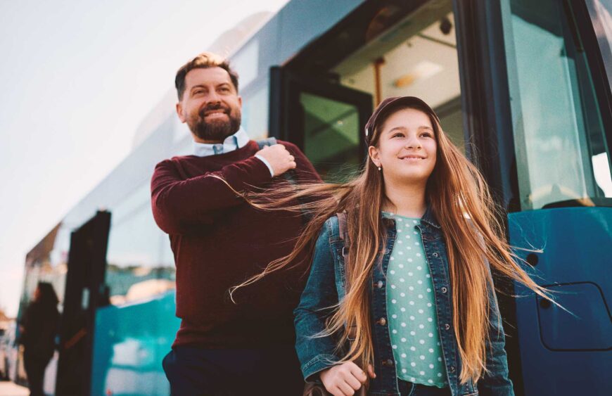 happy-girl-and-her-father-getting-off-the-bus-at-t-2024-12-13-19-21-44-utc