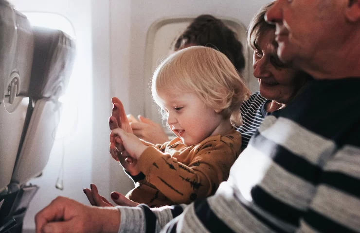 little-cute-boy-having-fun-sitting-on-a-plane-with-2024-12-02-21-25-07-utc.webp