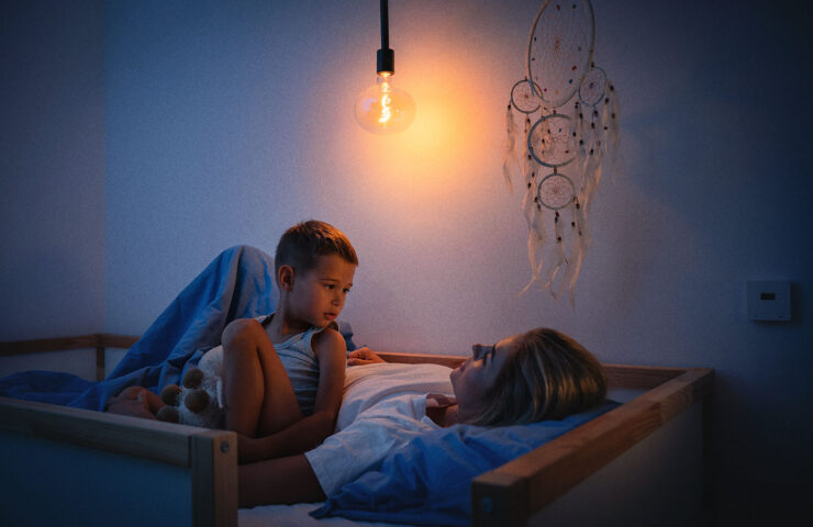 mother-and-her-son-share-a-tender-bedtime-moment-2024-10-18-04-03-11-utc