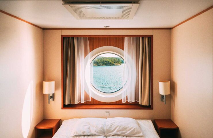 ship-window-in-craft-cabin-with-bed-view-on-sea-2025-02-24-18-13-31-utc