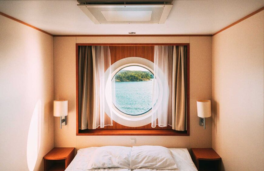 ship-window-in-craft-cabin-with-bed-view-on-sea-2025-02-24-18-13-31-utc