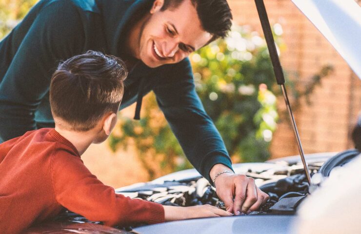 the-father-and-son-fixing-under-the-car-hood-2024-11-26-01-48-51-utc