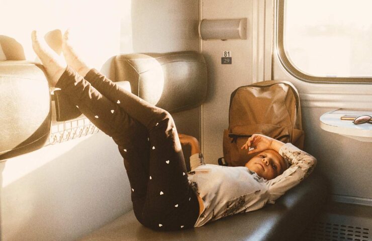 tired-child-riding-in-train-family-travel-2025-03-08-13-42-07-utc