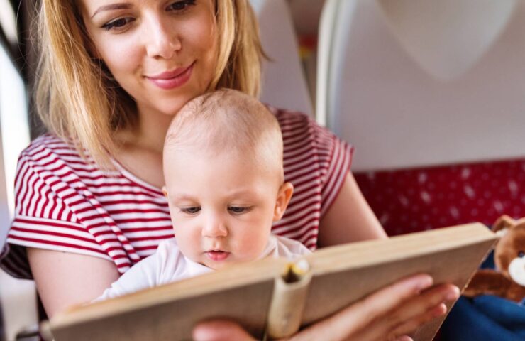 young-mother-travelling-with-baby-by-train-2024-10-20-09-46-14-utc