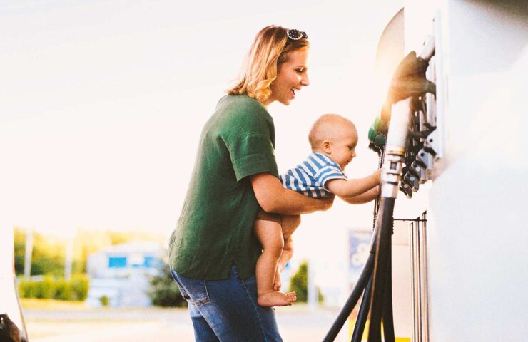 young-mother-with-baby-boy-at-the-petrol-station-2024-10-21-01-00-39-utc