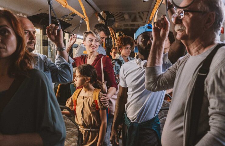 multigenerational-group-of-travelers-on-a-busy-ele-2025-02-22-01-44-45-utc