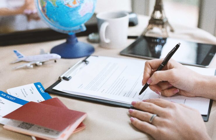 a-female-travel-agent-in-the-office-signs-a-contra-2025-01-10-20-35-25-utc