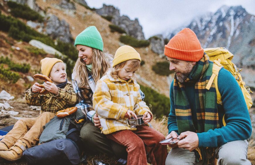 happy-family-resting-having-snack-during-hiking-t-2024-10-18-08-54-15-utc