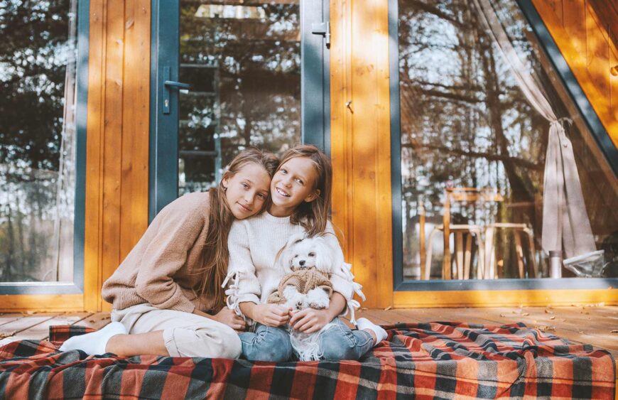 happy-kids-sitting-on-the-terrace-of-their-house-i-2025-02-11-15-59-24-utc