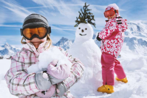 austria_winter_two-girls-with-a-snowman