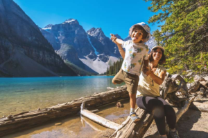 canada_mother-and-son-enjoying-moraine-lake-in-banff
