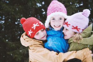 denmark_winter_children-hugging-in-the-snow