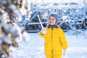 swedena-happy-little-girl-in-yellow-jumpsuit-holding-ice