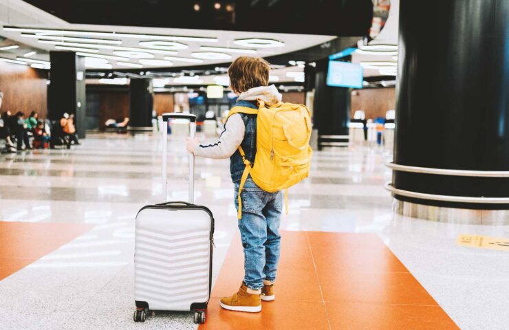 child-kid-boy-with-backpack-and-suitcase-in-airport