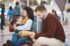 phone-tired-and-interracial-family-waiting-at-the-2026-01-09-11-49-57-utc-(1)